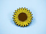 Roox Penelope's sunflower pin that she wore on her first date with Andrea Munger.