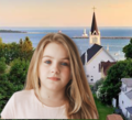 Maddy at age 10. In the background is Arch Rock on Mackinac Island, Michigan, Earth.