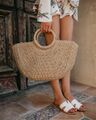 The straw hand bag used to carry beach essentials while hanging out with Sal and Karen in Little Risa.