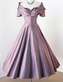Sheila wore this iridescent purple party dress when she ran into Alora after the festival and then later in her nightmare. The dress once belonged to her mother.