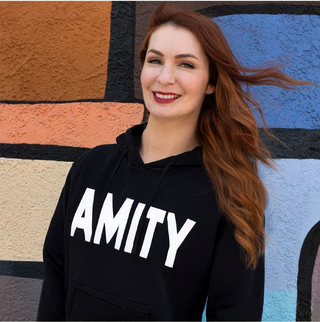 Wearing her Amity hoodie with pride (2401)