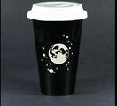 The black and white travel mug with star design that Bailey can be seen using at the the mission briefing for the 239707.26 mission start.